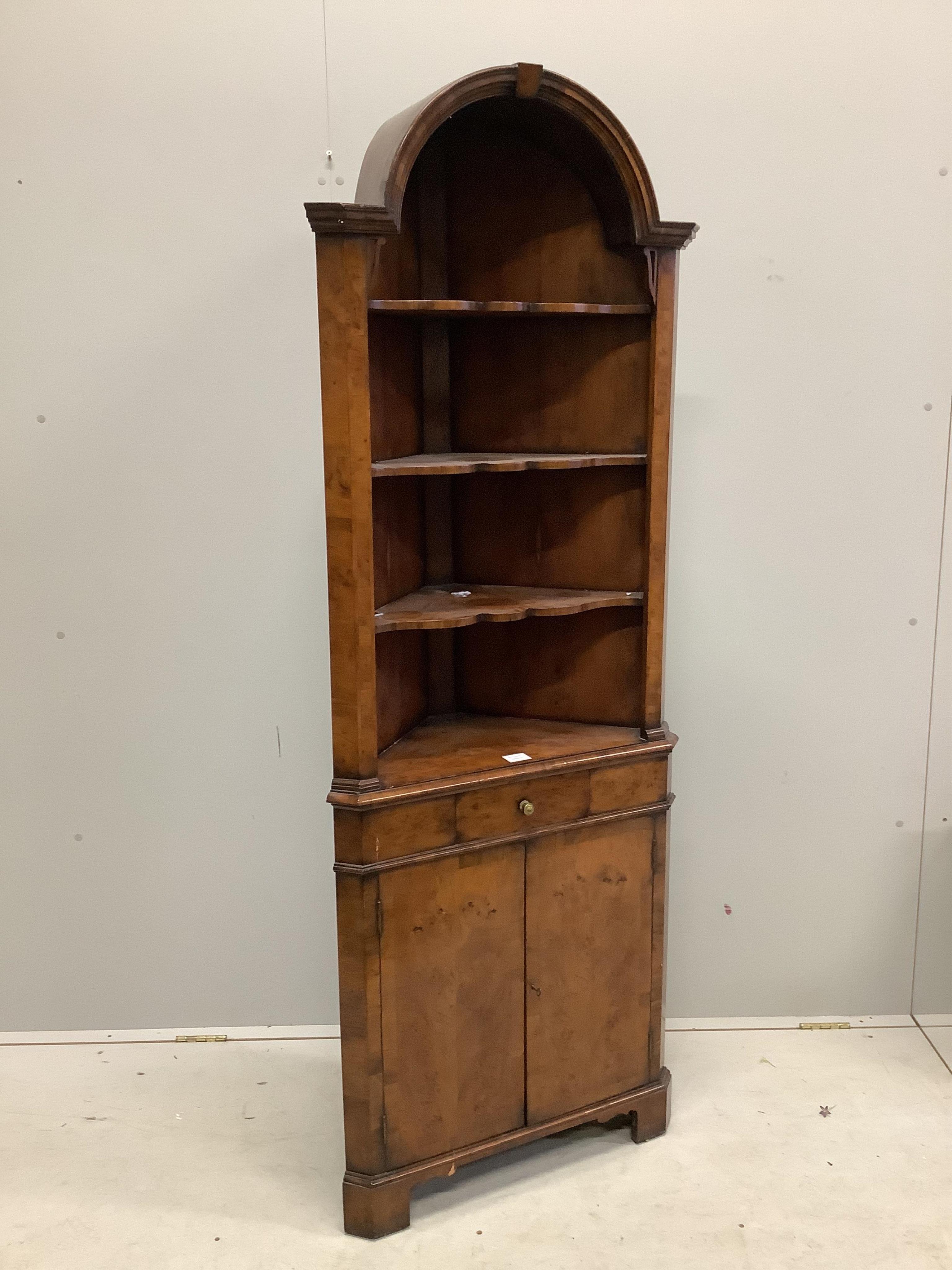 A Queen Anne Revival yew standing corner cupboard, width 66cm, depth 34cm, height 182cm. Condition - fair to good